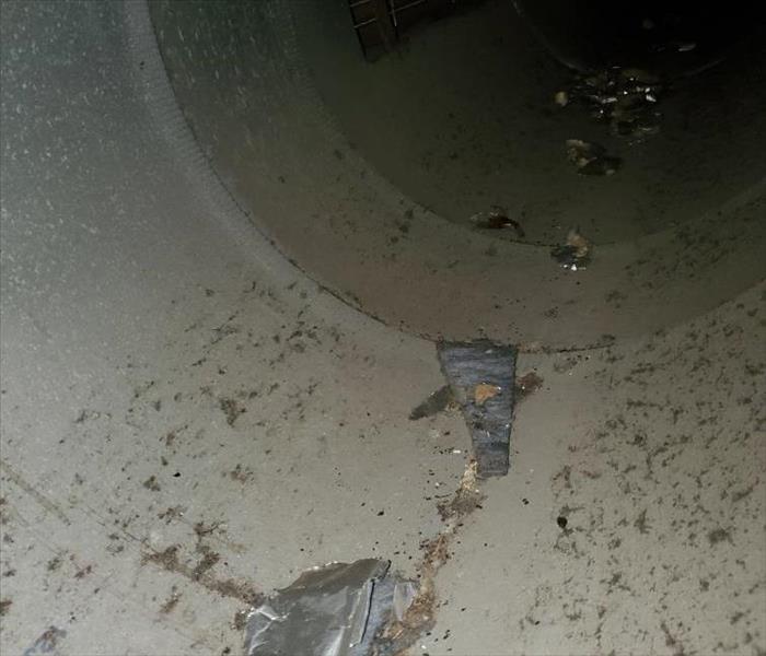 tin HVAC vent with debris in it