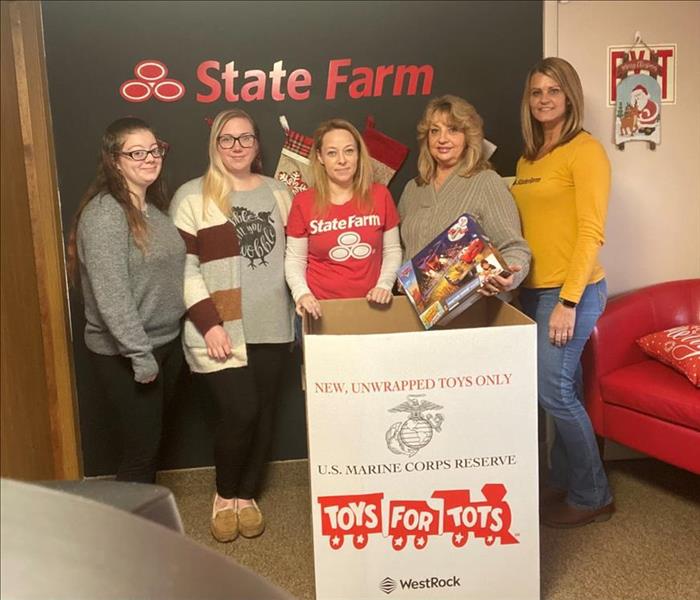 State Farm reps with Toys for Tots box and Toy