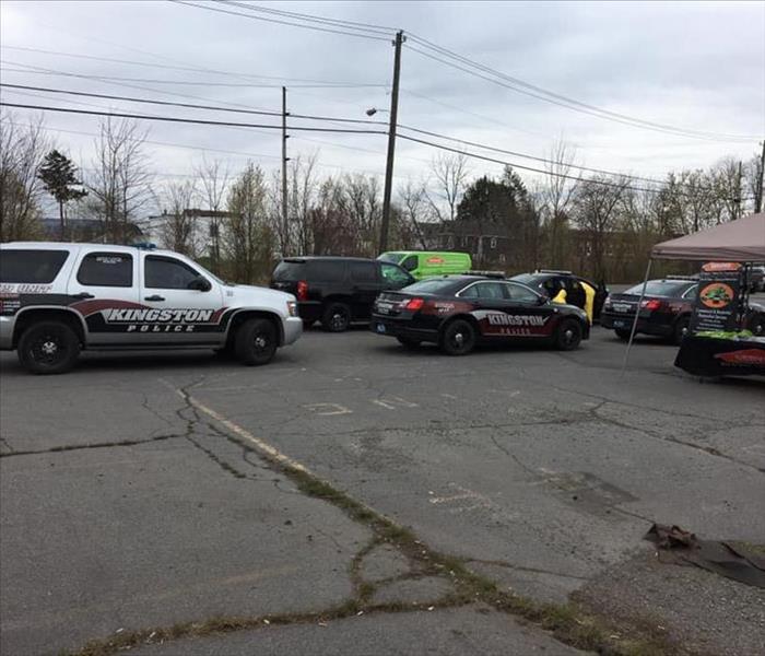 Kingston police department black vehicles in parking lot