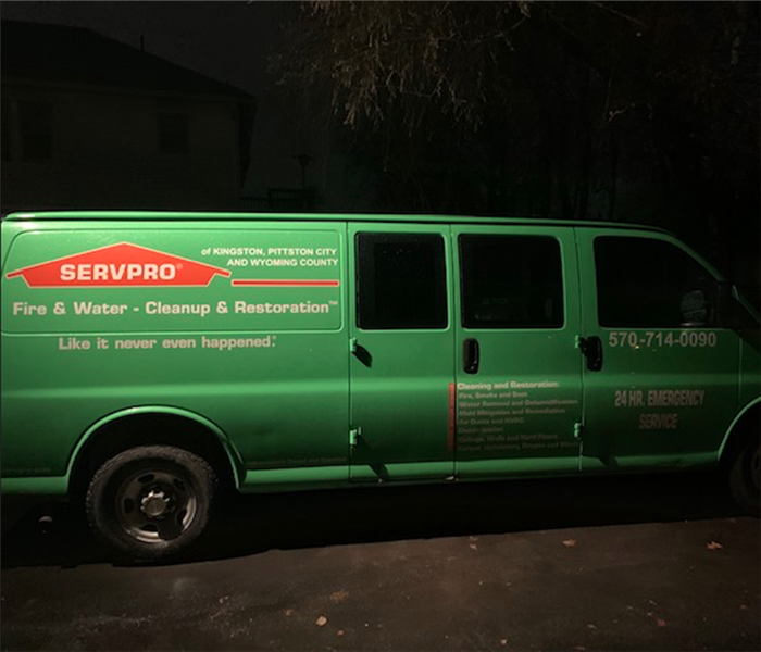 SERVPRO green van in parking lot during the night