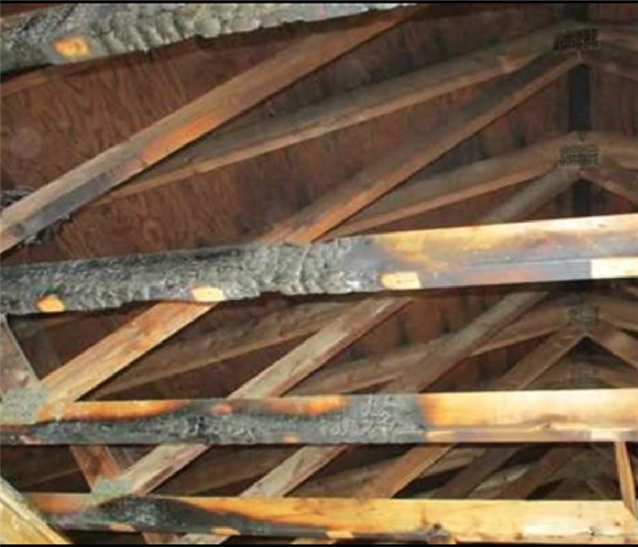 Burnt wood ceiling beams from residential fire