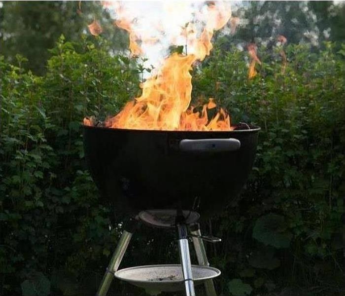 grill with flames coming from it