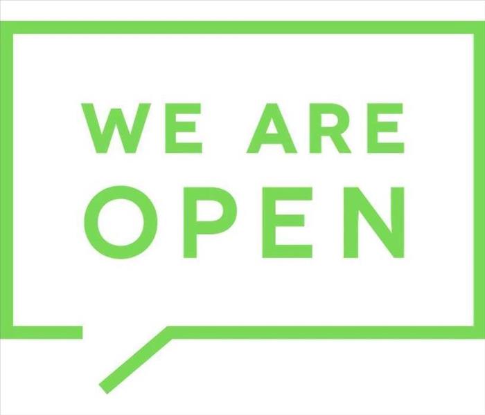 Picture with lime green text that reads "We are Open"