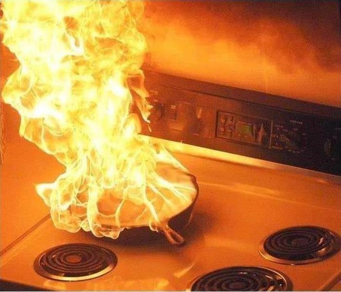 fire started in fry pan stovetop 